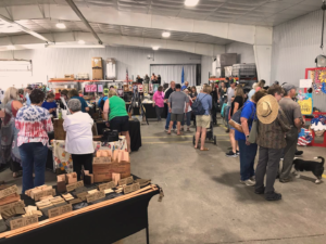 a large crowd of people and booths at an arts festival