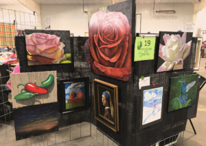 paintings on display at an arts festival