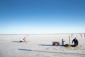 a family digging for crystals at great salt plains