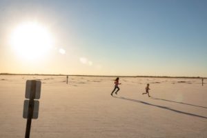 two children running across the great salt plains